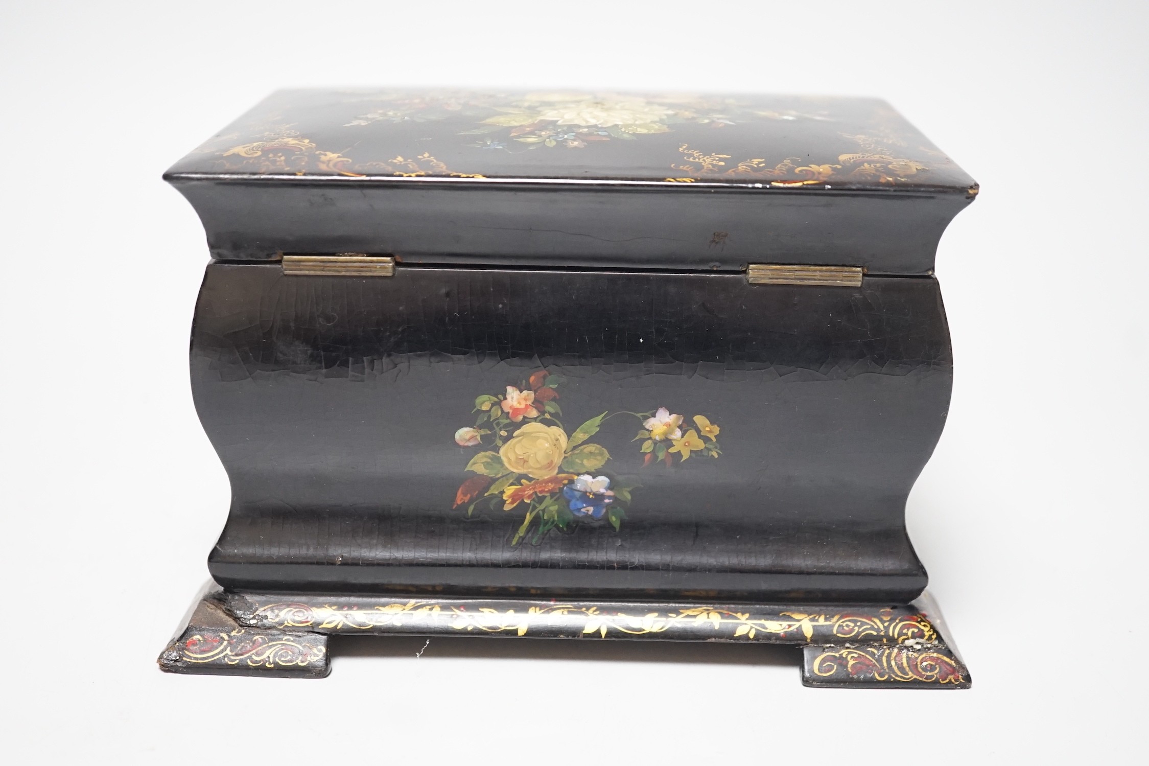 A Victorian papier-mâché bombé tea caddy with painted floral and gilt decoration. 12.5cm high